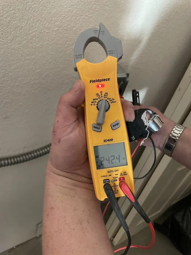 Voltage testing with clamp meter during Whole House Surge Protector in Dobbs Ferry